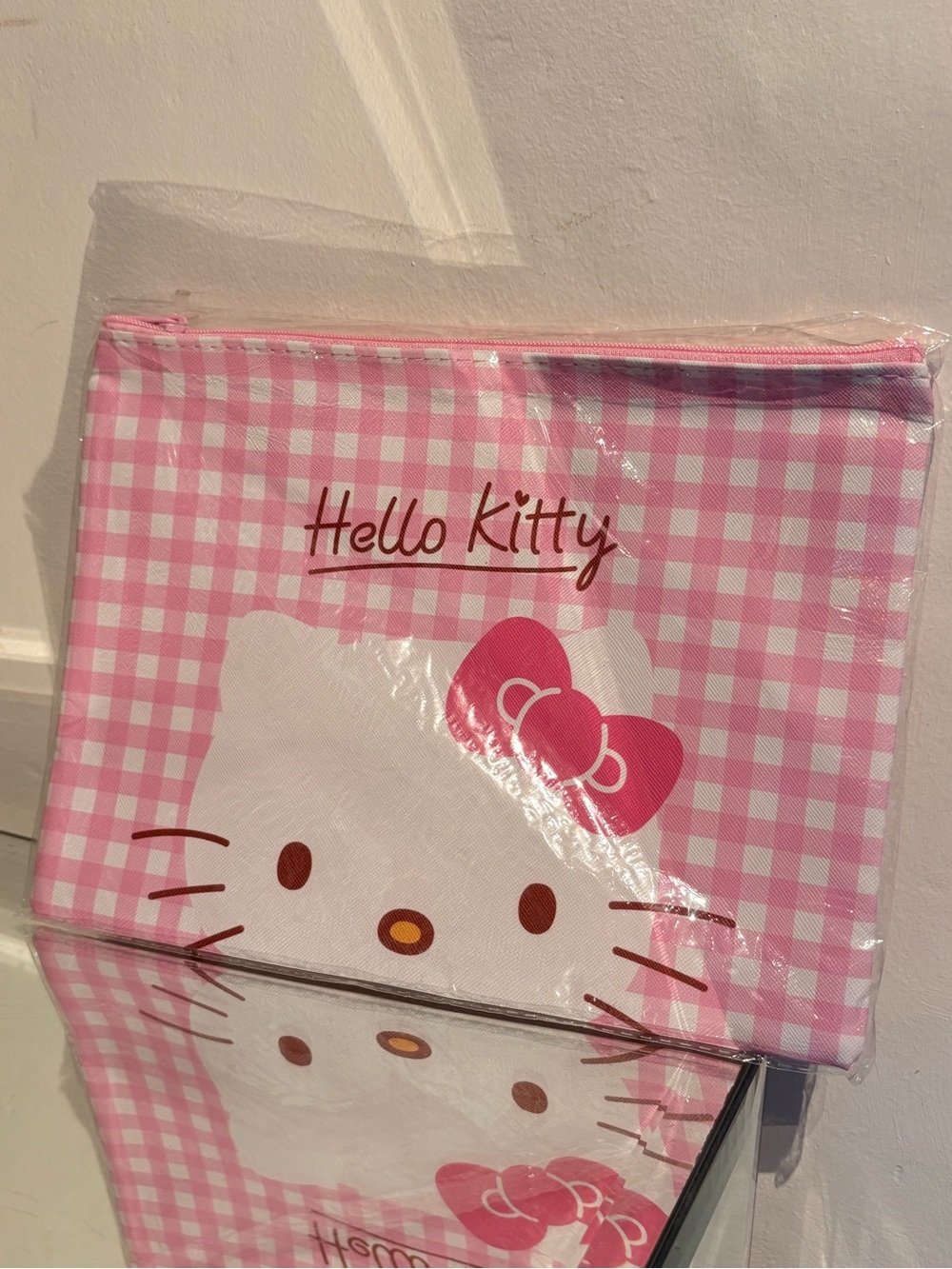 Hello kitty plaid zip up bag.